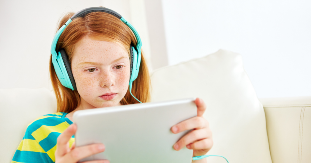 Girl Using Table With Headphones
