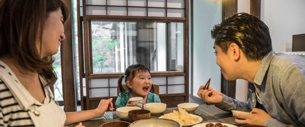 Family Interacting At Dinner Time Without Technology
