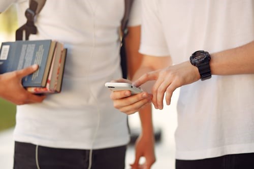 Student Pointing To Phone